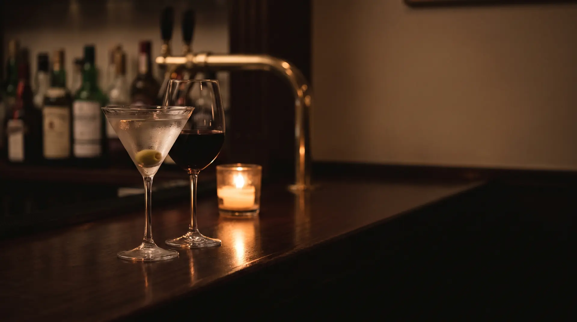 A martini and glass of red wine by candlelight at Amedeo's lounge